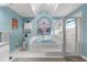 Airy bathroom with a soaking tub, separate shower, and light blue walls at 8200 Rhanbuoy Rd, Spring Hill, FL 34606