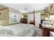 Comfortable bedroom featuring olive green walls and a decorative four-poster bed at 8200 Rhanbuoy Rd, Spring Hill, FL 34606