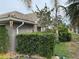 Charming single-Gathering home with neutral paint, tile roof, manicured landscaping and lush green foliage at 8200 Rhanbuoy Rd, Spring Hill, FL 34606