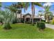 Well-maintained home with mature landscaping and a screened garage at 8200 Rhanbuoy Rd, Spring Hill, FL 34606