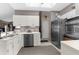 Bright kitchen with white cabinetry, stainless steel appliances, and ample counter space for meal preparation and storage at 8200 Rhanbuoy Rd, Spring Hill, FL 34606