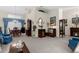 Inviting living room featuring a fireplace, unique decor, and carpet flooring at 8200 Rhanbuoy Rd, Spring Hill, FL 34606