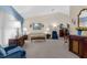 Comfortable living room featuring neutral decor, carpet flooring, and generous seating at 8200 Rhanbuoy Rd, Spring Hill, FL 34606