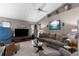 Comfortable living room with sofa and natural light, creating a relaxing space for entertainment and relaxation at 8200 Rhanbuoy Rd, Spring Hill, FL 34606