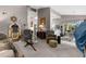 Spacious living room with comfortable seating, providing an ideal space for relaxation and entertainment with a view of the kitchen at 8200 Rhanbuoy Rd, Spring Hill, FL 34606