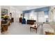 Bright living room with large windows and ample natural light, showcasing neutral carpet flooring at 8200 Rhanbuoy Rd, Spring Hill, FL 34606