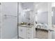 Bright bathroom features white cabinets, granite counter and walk-in shower at 8312 40Th N St, Pinellas Park, FL 33781