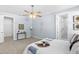 Bright bedroom features a ceiling fan, walk-in closet and en-suite bathroom with walk-in shower at 8312 40Th N St, Pinellas Park, FL 33781