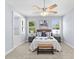 Spacious bedroom with bright natural light, ceiling fan and en suite bathroom at 8312 40Th N St, Pinellas Park, FL 33781