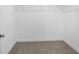 Walk-in closet with carpeted floors and wire shelving for organized storage at 8312 40Th N St, Pinellas Park, FL 33781