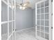 The room has double doors and a ceiling fan at 8312 40Th N St, Pinellas Park, FL 33781