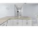 Bright kitchen featuring an island with marble countertops, white cabinets and stainless steel pulls at 8312 40Th N St, Pinellas Park, FL 33781