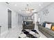 Bright living room features tile floors, ceiling fan, and modern decor accents at 8312 40Th N St, Pinellas Park, FL 33781