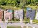 Birds eye view of homes in the neighborhood, showcasing backyard pools and mature landscaping at 8606 Coral Creek Loop, Hudson, FL 34667