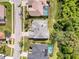 Top-down aerial shot of a home showcasing its roof, yard, and neighborhood at 8606 Coral Creek Loop, Hudson, FL 34667