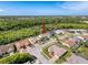 Aerial photo with an arrow pointing to the home, the neighborhood, and the surrounding area at 8606 Coral Creek Loop, Hudson, FL 34667