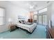 Bright bedroom with lots of natural light, fan, and access to a porch or balcony at 8606 Coral Creek Loop, Hudson, FL 34667