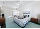 Bright bedroom with a ceiling fan and a window providing natural light at 8606 Coral Creek Loop, Hudson, FL 34667
