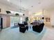 Spacious living room with high ceilings, ceiling fans, and sliding glass doors to the lanai at 8606 Coral Creek Loop, Hudson, FL 34667