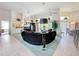 Spacious living room featuring high ceilings and bar area at 8606 Coral Creek Loop, Hudson, FL 34667
