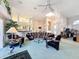 Bright and airy living room featuring open layout, high ceilings, and large windows for natural light at 8606 Coral Creek Loop, Hudson, FL 34667