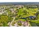 An aerial view of the golf course, community, and surrounding natural beauty at 11050 Kiskadee Cir, New Port Richey, FL 34654
