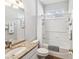 Bathroom featuring granite vanity, white tiled walls, and shower with tub at 11050 Kiskadee Cir, New Port Richey, FL 34654