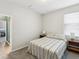 Cozy bedroom features neutral decor, carpet flooring, and two bedside tables with lamps at 11050 Kiskadee Cir, New Port Richey, FL 34654