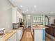 Bright kitchen with white cabinetry, stainless steel appliances and granite countertops at 11050 Kiskadee Cir, New Port Richey, FL 34654