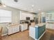 Bright kitchen with white cabinetry, stainless steel appliances and granite countertops at 11050 Kiskadee Cir, New Port Richey, FL 34654
