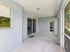 Screened in lanai with sliding glass doors and windows, with a door leading to the backyard at 11050 Kiskadee Cir, New Port Richey, FL 34654