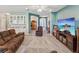 Spacious living room with views into the entryway, breakfast nook, and comfortable seating at 11050 Kiskadee Cir, New Port Richey, FL 34654