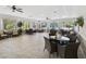 Comfortable lounge area with seating, tables, and views of the surrounding landscape at 11050 Kiskadee Cir, New Port Richey, FL 34654