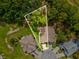 An aerial view of a single-Gathering home with an outlined property line and beautiful trees at 11524 Holly Ann Dr, New Port Richey, FL 34654