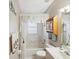 Bathroom featuring a bath, shower, and vanity with ample space and good lighting at 11524 Holly Ann Dr, New Port Richey, FL 34654
