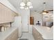 Well-lit kitchen features ample counter space and storage cabinets with a view to the front of the house at 11524 Holly Ann Dr, New Port Richey, FL 34654