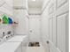 Functional laundry room with washer, dryer, shelving, and ample storage space at 11524 Holly Ann Dr, New Port Richey, FL 34654