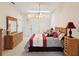Spacious main bedroom with skylight, carpet flooring, and traditional furnishings at 11524 Holly Ann Dr, New Port Richey, FL 34654