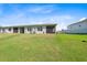 Lush, green backyard with ample space for outdoor activities and relaxation at 12214 Grizzly Ln, New Port Richey, FL 34654
