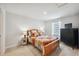 Cozy bedroom with a wood bedframe and warm lighting at 12214 Grizzly Ln, New Port Richey, FL 34654
