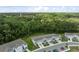 Exterior shot of modern townhomes with attached garages and a nearby parking area at 12214 Grizzly Ln, New Port Richey, FL 34654