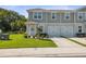 Inviting townhome with lush lawn, garden, and convenient one-car garage at 12214 Grizzly Ln, New Port Richey, FL 34654