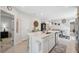 Spacious kitchen island with stainless steel appliances, sink and view to living and dining areas at 12214 Grizzly Ln, New Port Richey, FL 34654