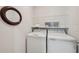 Bright laundry room with modern washer and dryer at 12214 Grizzly Ln, New Port Richey, FL 34654