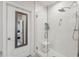 Modern bathroom shower with glass door and white subway tile at 12214 Grizzly Ln, New Port Richey, FL 34654