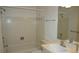 The bathroom has a tiled shower and tub combo and a single sink vanity at 12371 Dearborn Dr, Hudson, FL 34667