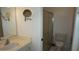 Functional bathroom with a vanity, mirror, and a separate shower and toilet area at 12371 Dearborn Dr, Hudson, FL 34667
