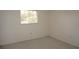 Neutral bedroom with window, carpet flooring, and light walls at 12371 Dearborn Dr, Hudson, FL 34667