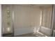 Bright Florida room with neutral flooring and vertically blinds offering privacy at 12371 Dearborn Dr, Hudson, FL 34667