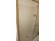 The bathroom features a walk-in shower with bright tile and silver hardware at 12371 Dearborn Dr, Hudson, FL 34667